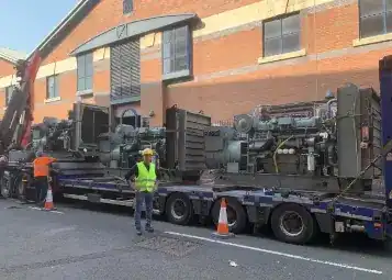 amir standing in front of a loaded lorry