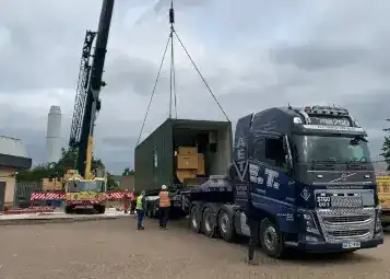 generator being loaded onto truck